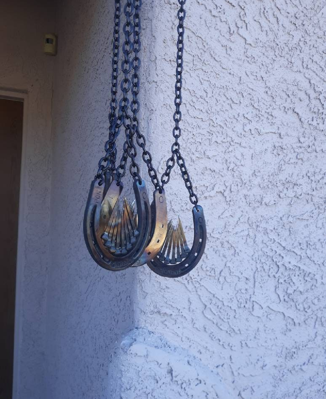 Horseshoe Hanging Wind "Unchime" accented with Horseshoe Nails